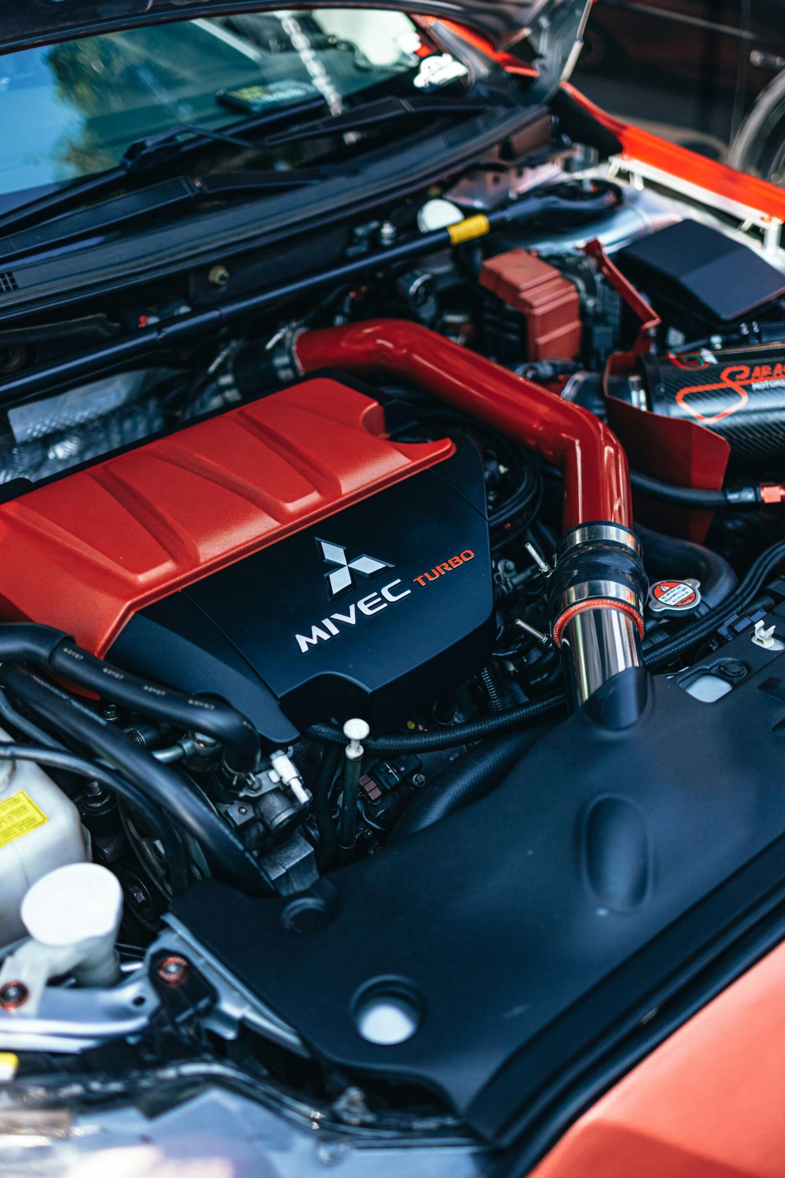 Detailed image of a high-performance MIVEC turbo engine showcasing modern automotive design.